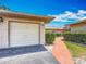 View of the detached garage with easy access to the charming walkway at 2188 Corinne S Ct # A, St Petersburg, FL 33712