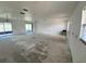 Spacious living room featuring sliding glass door access to the lanai and neutral walls at 2188 Corinne S Ct # A, St Petersburg, FL 33712