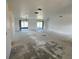 Spacious living room featuring access to lanai and doorway to bedrooms and bathrooms at 2188 Corinne S Ct # A, St Petersburg, FL 33712