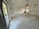 Living room with access to the lanai and windows for natural light at 2188 Corinne S Ct # A, St Petersburg, FL 33712