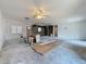 Large living room under construction, featuring bright ceiling fan, and new flooring at 2188 Corinne S Ct # A, St Petersburg, FL 33712