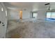 Spacious living room featuring access to lanai and doorway to bedrooms and bathrooms at 2188 Corinne S Ct # A, St Petersburg, FL 33712
