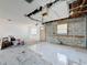 Living room under construction featuring tile flooring and a partially open ceiling at 2188 Corinne S Ct # A, St Petersburg, FL 33712