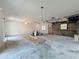 Renovated living room with ceiling fan, and partially exposed brick details at 2188 Corinne S Ct # A, St Petersburg, FL 33712