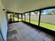 Enclosed patio with tiled floors and screened openings to the exterior landscaping at 2188 Corinne S Ct # A, St Petersburg, FL 33712