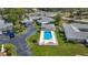 Aerial view of a home with a private pool surrounded by well-manicured landscaping at 2188 Corinne S Ct # A, St Petersburg, FL 33712