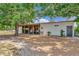 Exterior view of horse barn, featuring an open-air stalls, providing space and comfort for livestock on a private property at 22803 67Th E Ave, Bradenton, FL 34211