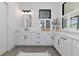 A renovated bathroom features a large countertop and natural light for an appealing and relaxing space at 22803 67Th E Ave, Bradenton, FL 34211