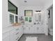 The renovated bathroom features a large countertop and natural light for an appealing and relaxing space at 22803 67Th E Ave, Bradenton, FL 34211