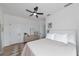Bright bedroom features a ceiling fan, neutral tones and a window showcasing outdoor views at 22803 67Th E Ave, Bradenton, FL 34211