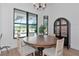 Dining room with round table and views of the pool at 22803 67Th E Ave, Bradenton, FL 34211