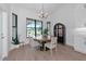 Bright dining room with modern chandelier and views of the backyard at 22803 67Th E Ave, Bradenton, FL 34211