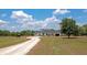 Beautiful exterior view of the home and property, showcasing its serene and expansive surroundings at 22803 67Th E Ave, Bradenton, FL 34211