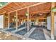Well-maintained horse barn featuring open stalls, concrete floor, and a wooden structure, ideal for equestrian enthusiasts at 22803 67Th E Ave, Bradenton, FL 34211