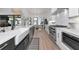 Bright kitchen featuring a long island with a sink and dining area and stainless steel appliances at 22803 67Th E Ave, Bradenton, FL 34211