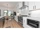 Bright kitchen featuring a stainless steel oven and stovetop and white stone countertops at 22803 67Th E Ave, Bradenton, FL 34211