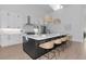 Bright kitchen featuring an island with bar seating, modern appliances, white cabinets, and a skylight at 22803 67Th E Ave, Bradenton, FL 34211