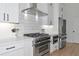 Modern kitchen with stainless steel appliances, white cabinets, subway tile backsplash, and stone countertops at 22803 67Th E Ave, Bradenton, FL 34211