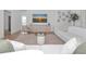 Comfortable living room with a plush white sofa, decorative glass table, and wall art at 22803 67Th E Ave, Bradenton, FL 34211