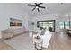 Bright living room with light wood floors and neutral decor at 22803 67Th E Ave, Bradenton, FL 34211