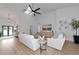 Bright living room with vaulted ceiling, modern fan, light wood floors and contemporary decor at 22803 67Th E Ave, Bradenton, FL 34211