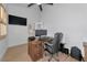 Office space features a modern desk, ceiling fan, hardwood floors, and a comfortable chair at 22803 67Th E Ave, Bradenton, FL 34211