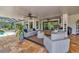 Spacious covered patio with views of the pool and beautifully landscaped backyard at 22803 67Th E Ave, Bradenton, FL 34211