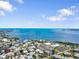Expansive aerial view of waterfront community with stunning ocean views on a sunny day at 229 S Harbor Dr, Holmes Beach, FL 34217