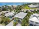 Beautiful aerial view of a coastal community featuring lush landscaping and stunning waterfront properties at 229 S Harbor Dr, Holmes Beach, FL 34217