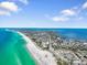 Expansive aerial view of the beachfront community, showing the beach and the homes at 229 S Harbor Dr, Holmes Beach, FL 34217