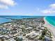 Panoramic aerial view of coastal community with beach and bay views at 229 S Harbor Dr, Holmes Beach, FL 34217