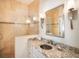 Elegant bathroom with granite countertop and a glass-enclosed shower at 229 S Harbor Dr, Holmes Beach, FL 34217