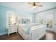 Coastal bedroom with white furniture and a ceiling fan at 229 S Harbor Dr, Holmes Beach, FL 34217
