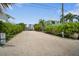Private boat launch ramp access for members only, surrounded by lush greenery and palm trees at 229 S Harbor Dr, Holmes Beach, FL 34217