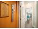 Residential elevator adjacent to hallway, featuring a 'Sea Side Rules' sign at 229 S Harbor Dr, Holmes Beach, FL 34217
