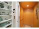 Convenient home elevator with wood paneling, adjacent to shelving at 229 S Harbor Dr, Holmes Beach, FL 34217
