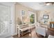 Entryway with a bench, small table, and coastal decor with natural light from the window at 229 S Harbor Dr, Holmes Beach, FL 34217
