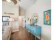 Bright hallway with a blue console table and decorative wall art at 229 S Harbor Dr, Holmes Beach, FL 34217