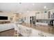 Modern kitchen with stainless steel appliances, granite countertops, a breakfast bar, and an open floor plan at 229 S Harbor Dr, Holmes Beach, FL 34217