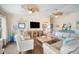Cozy living room featuring comfortable seating, stylish decor, and a mounted television for entertainment at 229 S Harbor Dr, Holmes Beach, FL 34217