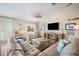Bright living room with comfortable sofas, a large TV, and decorative accents for a welcoming atmosphere at 229 S Harbor Dr, Holmes Beach, FL 34217
