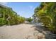 Private waterfront area with a sandy beach and scenic views of the calm canal at 229 S Harbor Dr, Holmes Beach, FL 34217