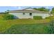 Exterior of a light blue home with a well-manicured lawn and garden at 2607 Lancaster Dr # 35, Sun City Center, FL 33573