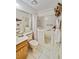 A modern bathroom with a vanity, walk-in tub, and safety bars for accessible bathing at 2607 Lancaster Dr # 35, Sun City Center, FL 33573