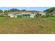 Charming single-story home with a well-kept lawn, mature landscaping, and an inviting entrance at 2607 Lancaster Dr # 35, Sun City Center, FL 33573