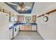 Well-lit kitchen showcasing cabinetry, stainless steel appliances, and decorative backsplash at 2607 Lancaster Dr # 35, Sun City Center, FL 33573