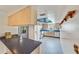 Spacious kitchen featuring countertops, stylish flooring, and an adjacent breakfast bar at 2607 Lancaster Dr # 35, Sun City Center, FL 33573