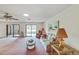 Cozy living room space showcasing pink carpet, decorative furniture, and an open floor plan at 2607 Lancaster Dr # 35, Sun City Center, FL 33573