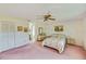 Cozy main bedroom with a ceiling fan, closet and access to a private ensuite bathroom at 2607 Lancaster Dr # 35, Sun City Center, FL 33573