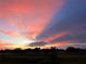 Breathtaking sunset over the community, displaying vibrant pink and blue hues across the expansive sky at 2607 Lancaster Dr # 35, Sun City Center, FL 33573
